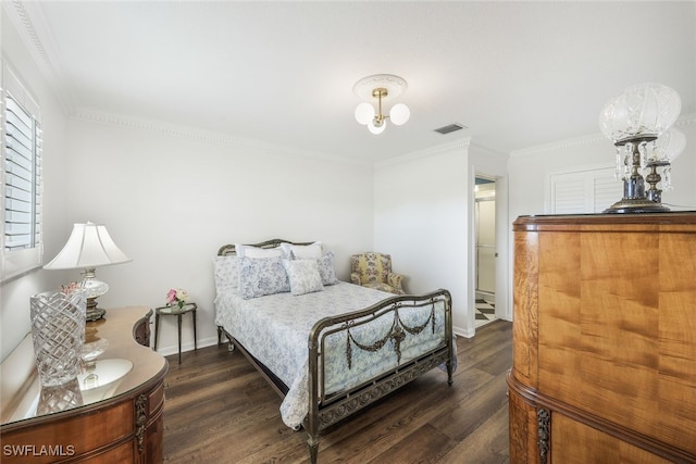 bedroom featuring dark wood-type flooring and ornamental molding