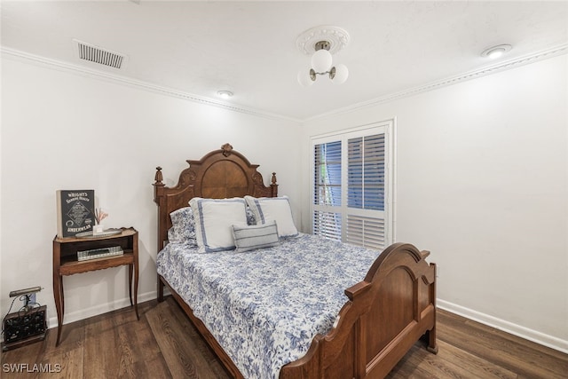 bedroom featuring dark hardwood / wood-style floors and crown molding