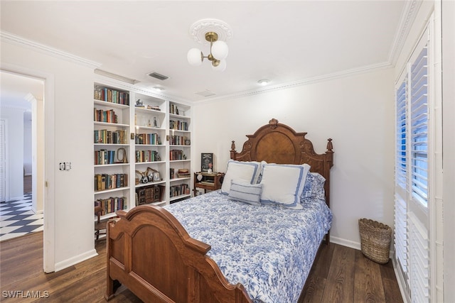 bedroom with dark hardwood / wood-style floors and ornamental molding