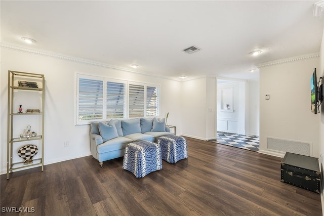 living room with dark hardwood / wood-style floors and ornamental molding