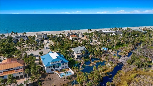 aerial view with a view of the beach and a water view