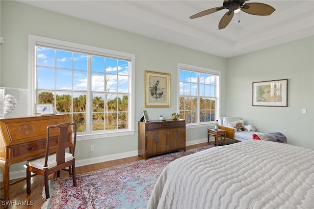 bedroom featuring ceiling fan and light hardwood / wood-style flooring