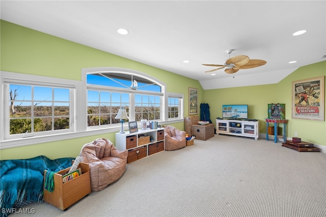 playroom with lofted ceiling, ceiling fan, and carpet floors