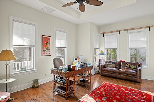 office space with ceiling fan, a wealth of natural light, and wood-type flooring