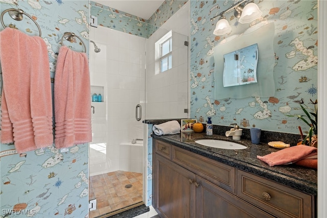 bathroom with vanity and an enclosed shower