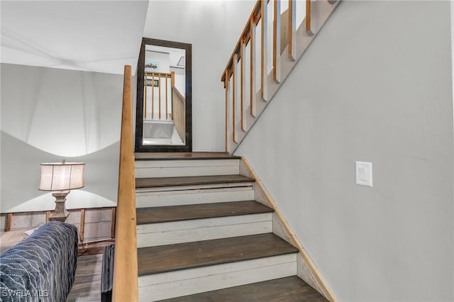 stairway with wood-type flooring