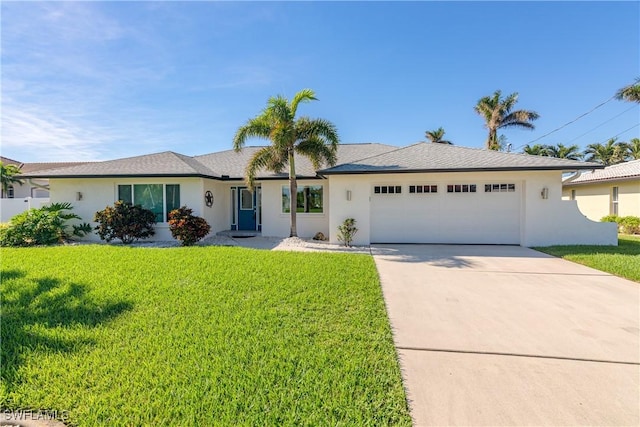 single story home featuring a garage, a front yard, concrete driveway, and stucco siding