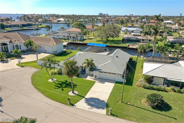 birds eye view of property featuring a water view