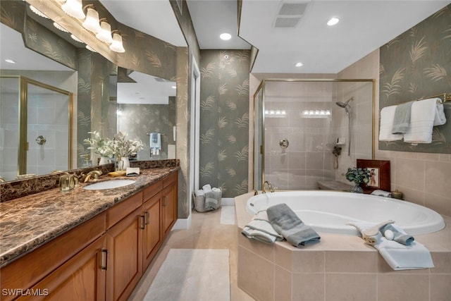 bathroom featuring vanity and shower with separate bathtub