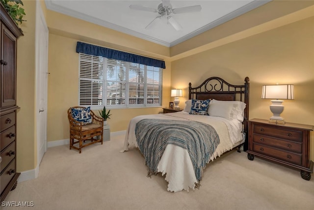 carpeted bedroom with crown molding and ceiling fan