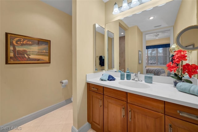 bathroom featuring vanity, tile patterned floors, and ceiling fan