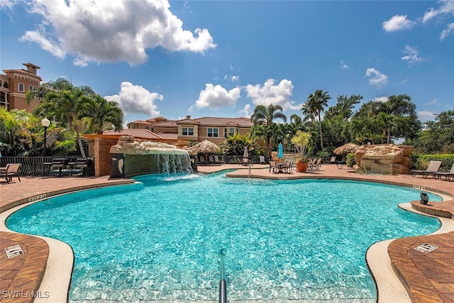 view of swimming pool with a patio area and pool water feature