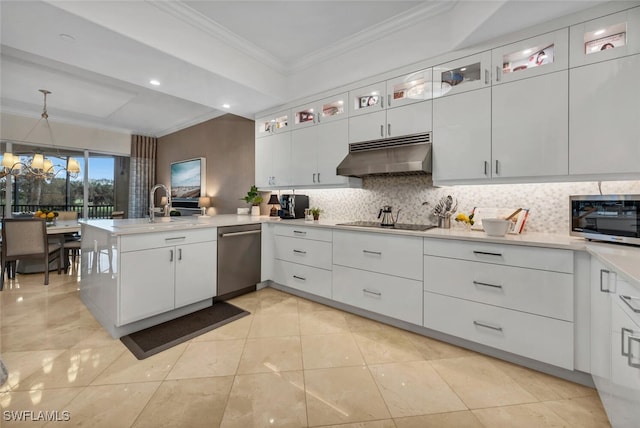 kitchen featuring white cabinets, backsplash, and appliances with stainless steel finishes