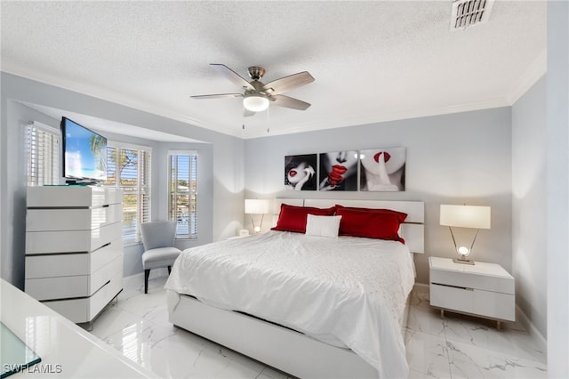 bedroom featuring a textured ceiling, ceiling fan, and ornamental molding