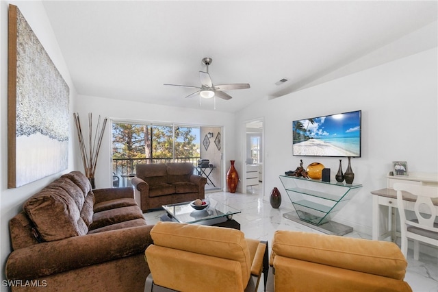 living room featuring ceiling fan and lofted ceiling