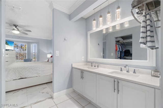 bathroom with ceiling fan, crown molding, vanity, and a textured ceiling