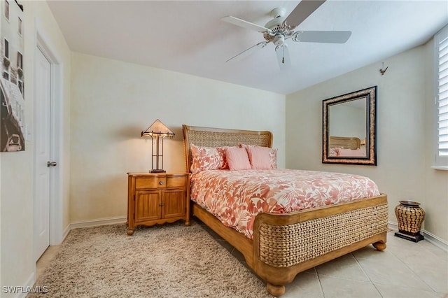 bedroom with ceiling fan and light tile patterned flooring