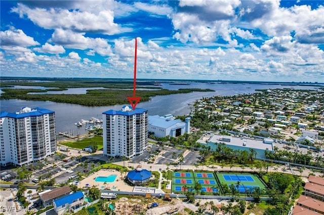 birds eye view of property with a water view