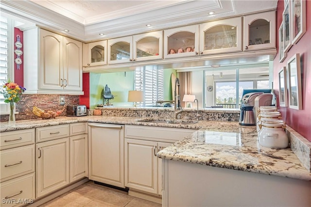 kitchen featuring crown molding, cream cabinets, sink, and a healthy amount of sunlight