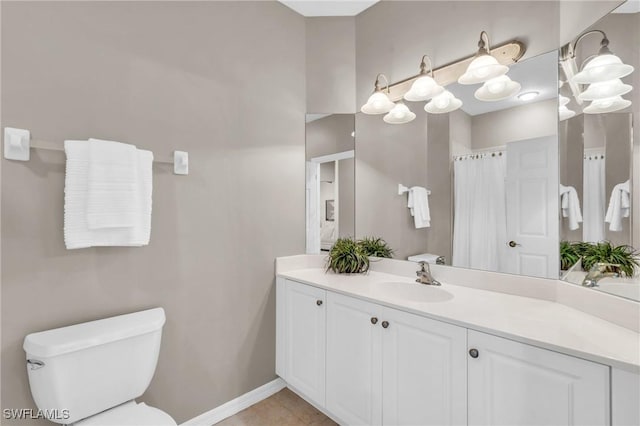 20111 Seagrove St Unit 604, Estero, FL 33928 - bathroom with toilet, vanity, baseboards, a shower with shower curtain, and tile patterned flooring