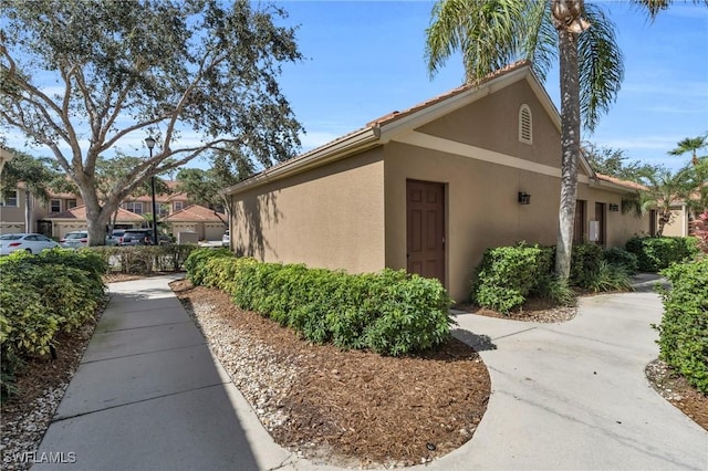20111 Seagrove St Unit 604, Estero, FL 33928 - view of property exterior featuring stucco siding