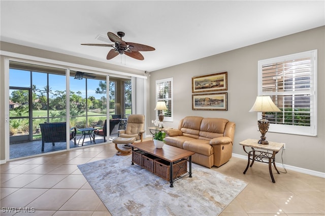 tiled living room with ceiling fan