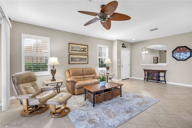 living room featuring ceiling fan and light tile patterned floors