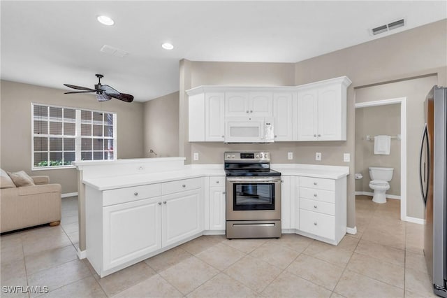 20111 Seagrove St Unit 604, Estero, FL 33928 - kitchen with stainless steel appliances, open floor plan, a peninsula, light countertops, and recessed lighting