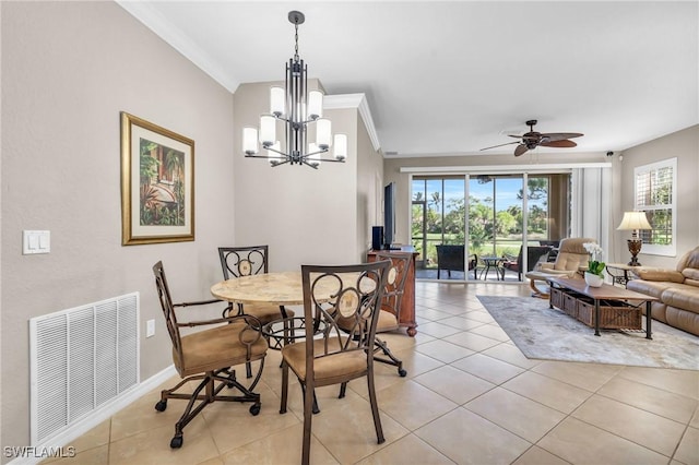 20111 Seagrove St Unit 604, Estero, FL 33928 - dining room featuring crown molding, light tile patterned floors, a chandelier, a ceiling fan, and baseboards