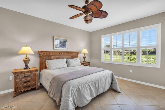 20111 Seagrove St Unit 604, Estero, FL 33928 - bedroom with light tile patterned floors, baseboards, and ceiling fan