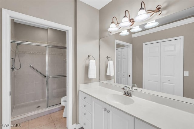 20111 Seagrove St Unit 604, Estero, FL 33928 - full bath with toilet, a shower stall, vanity, tile patterned flooring, and a closet