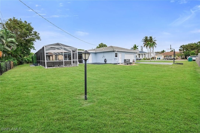 view of yard with a lanai