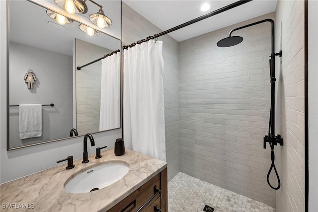 bathroom with vanity and a shower with shower curtain