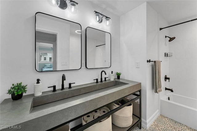 bathroom featuring vanity and washtub / shower combination