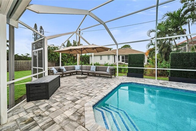 view of pool with a patio area, a lanai, and outdoor lounge area