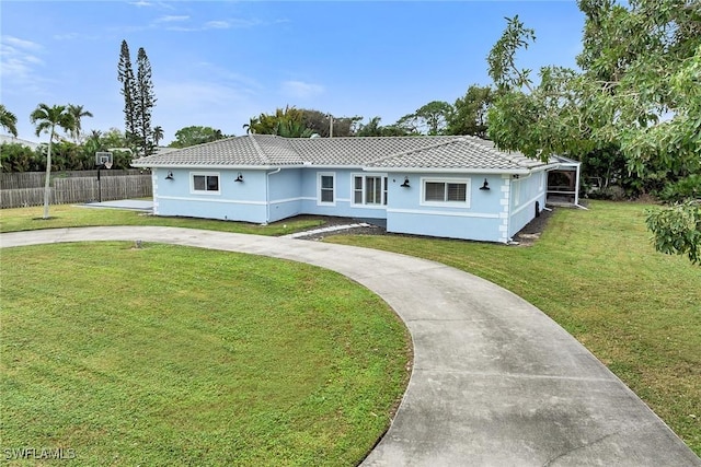 single story home with a front lawn and a carport