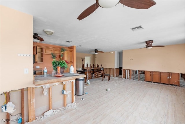 interior space with ceiling fan and light wood-type flooring