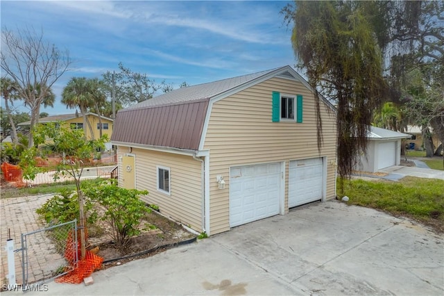 view of property exterior with a garage