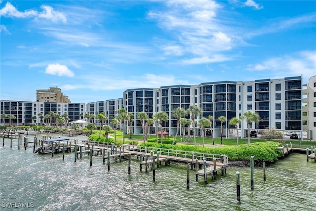 view of community featuring a dock and a water view