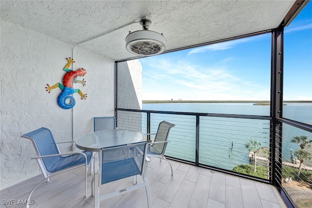 balcony featuring a water view