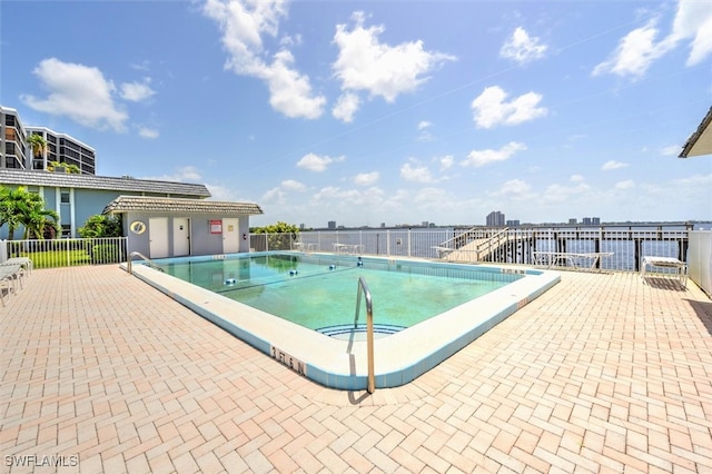 view of swimming pool with a patio area