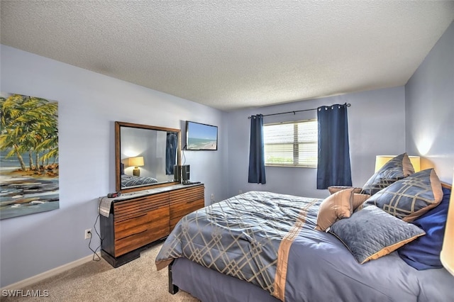 carpeted bedroom featuring a textured ceiling