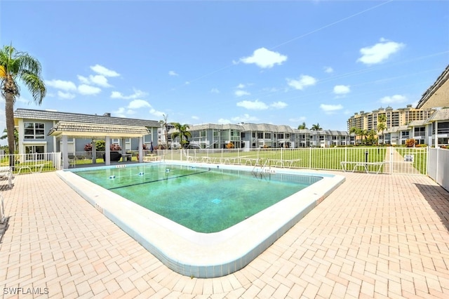 view of swimming pool with a pergola