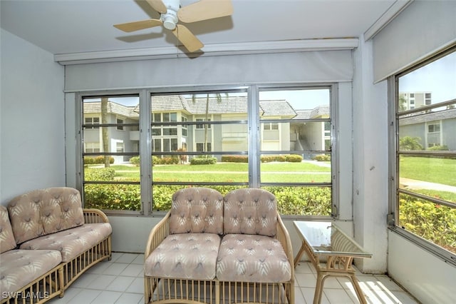 sunroom / solarium featuring ceiling fan