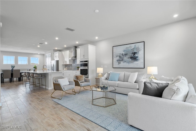 living room with light hardwood / wood-style floors