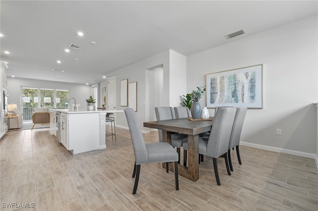 dining area with light wood-type flooring