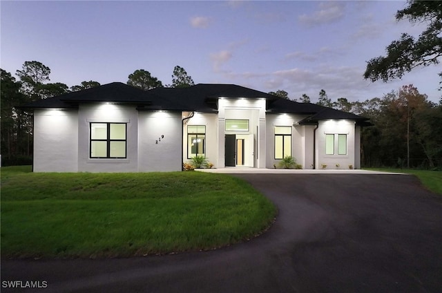 view of front of home featuring a yard