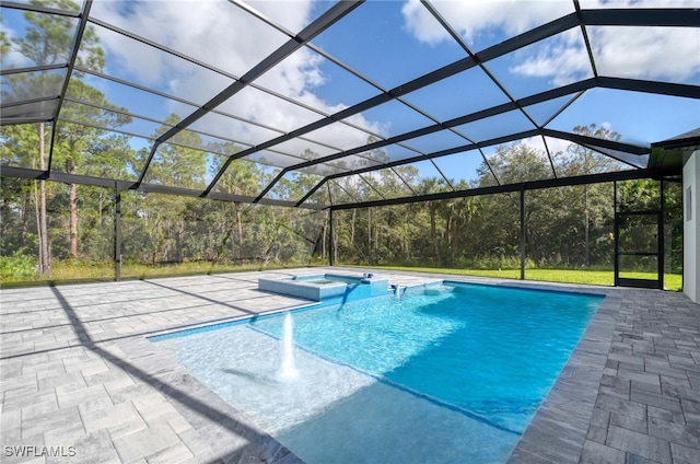 view of swimming pool with an in ground hot tub, a patio, and a lanai