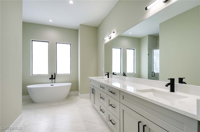 bathroom featuring vanity and independent shower and bath