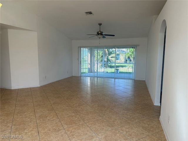 unfurnished room with light tile patterned floors and ceiling fan